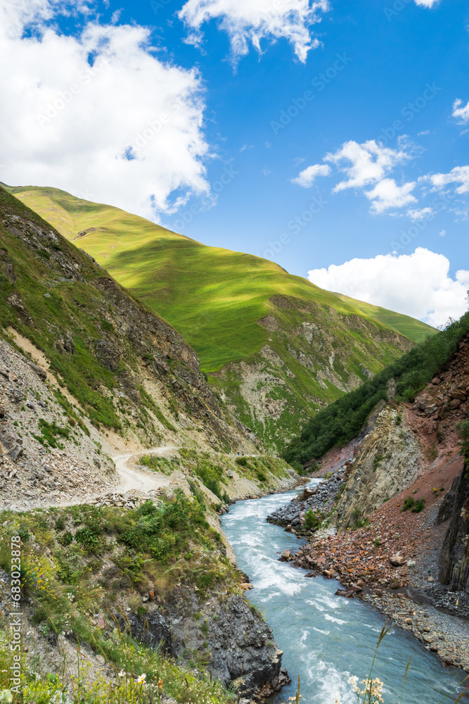 Summer hiking landscape in Georgia, Caucasus. Popular mountain hiking areas in Kazbegi, Truso Gorge area.