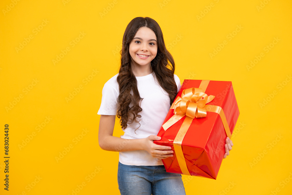Teenager child with gift box. Present for holidays. Happy birthday, Valentines day, New Year or Christmas. Kid hold present box. Happy teenage girl, positive and smiling emotions. Teenager child with gift box. Present for holidays. Happy birthday, Valentines day, New Year or Christmas. Kid hold present box. Happy teenage girl, positive and smiling emotions.