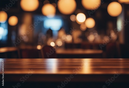 Empty wooden table and blurred background of night club with bokeh lights