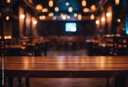 Empty wooden table and blurred background of night club with bokeh lights