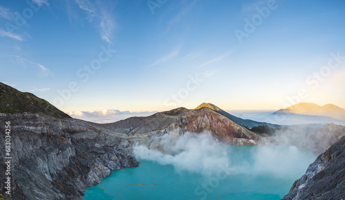 Mount Ijen, a volcano and sulphur mine located near Banyuwangi in East Java, Indonesia. Panoramic image of Ijen crater, a famous touristic destination for tourists in Java island, Indonesia.  photo