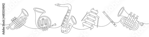 Set of wind musical instruments. Tuba, trumpet, french horn, saxophone, wooden xylophone, flute continuous one line illustration.