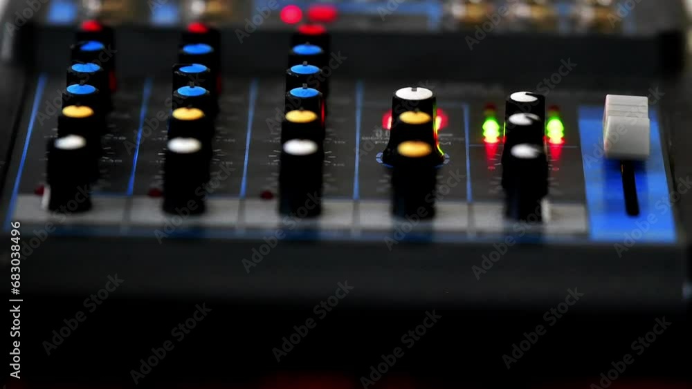 music mixer flushing lights and nubs, selective focus authentic video, close up