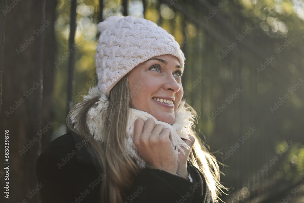 cheerful young woman with hat on the street cheerful young woman with hat on the street