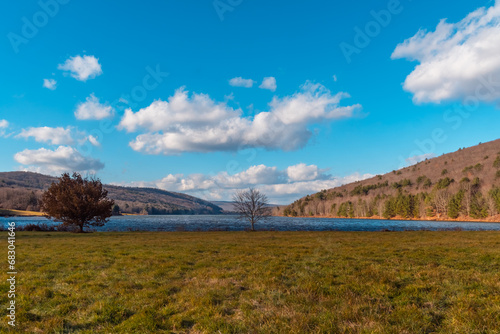 Quaker lake NY, mountain valley landscape late fall weather, sunny windy day photo