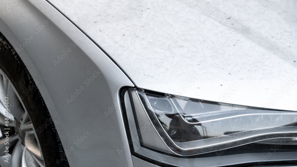 Fototapeta premium Details of dirty car before washing luxury silver car on touchless car wash. Cleaning the details of car. Cleanliness environment