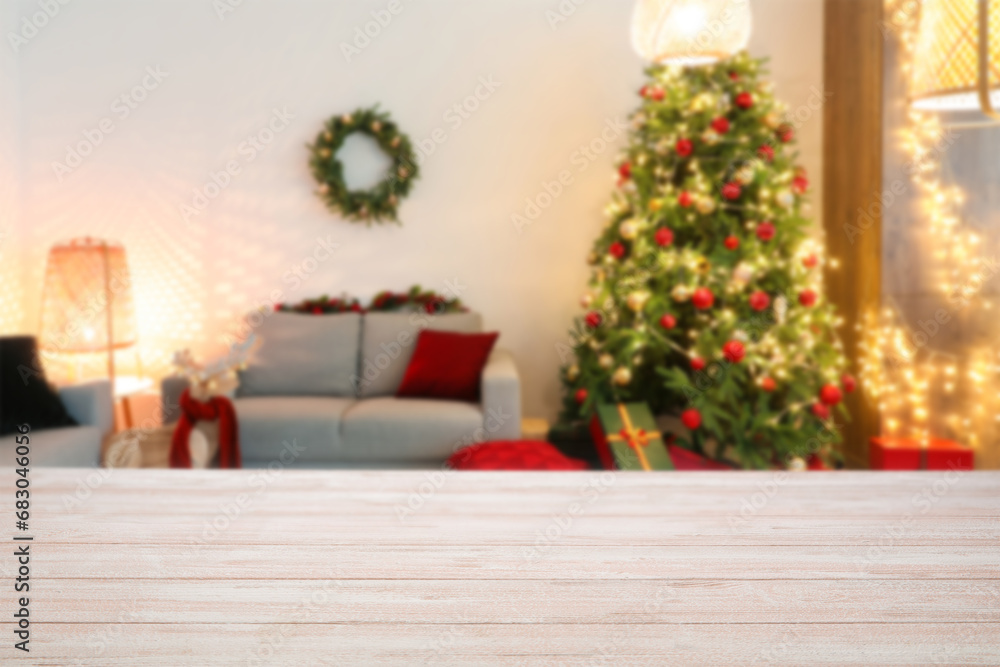 Empty wooden table in room decorated for Christmas Empty wooden table in room decorated for Christmas