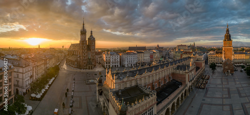 Aerial view of Main Square with St Mary's church and Cloth Hall in Krakow, Poland, during colorful sunrise