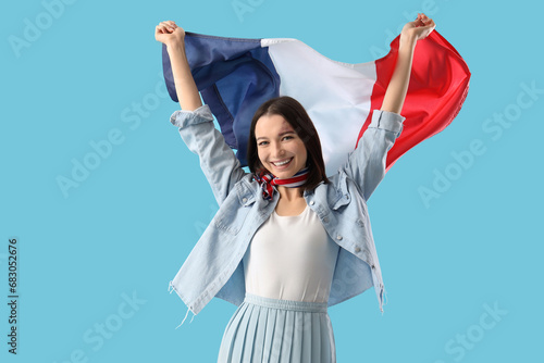 Happy young woman with flag...
