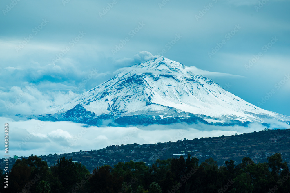 Mexican volcano Popocatepetl with snow since mexico city near of Xochimilco Mexican volcano Popocatepetl with snow since mexico city near of Xochimilco