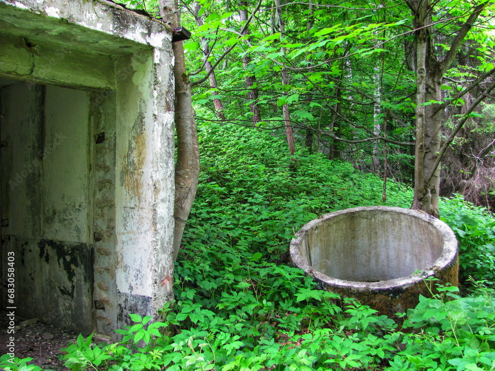 The entrance to the shelter from the rain and the well with drinking water on the territory of the national park The entrance to the shelter from the rain and the well with drinking water on the territory of the national park