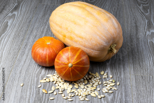 Image of pumpkin on a wooden surface providing space for products or descriptions. Thanksgiving day or autumn pumpkin holiday.