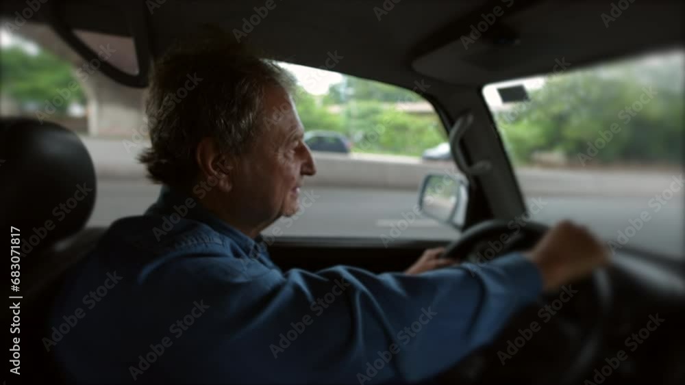 Older man driver holding steering wheel drives in city. Senior male caucasian person driving on road Older man driver holding steering wheel drives in city. Senior male caucasian person driving on road