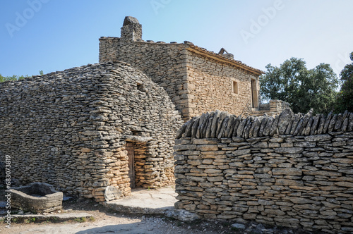 Dry stone hut in Village des Bories open air museum near Gordes village in Provence region of France photo