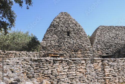 Dry stones hut in Village des Bories open air museum near Gordes village in Provence region of France photo