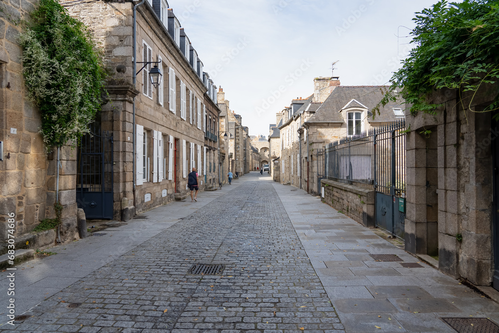a cobbled street in a French town, beautiful architecture a cobbled street in a French town, beautiful architecture
