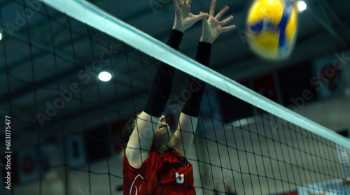 young woman volleyball player at match photo