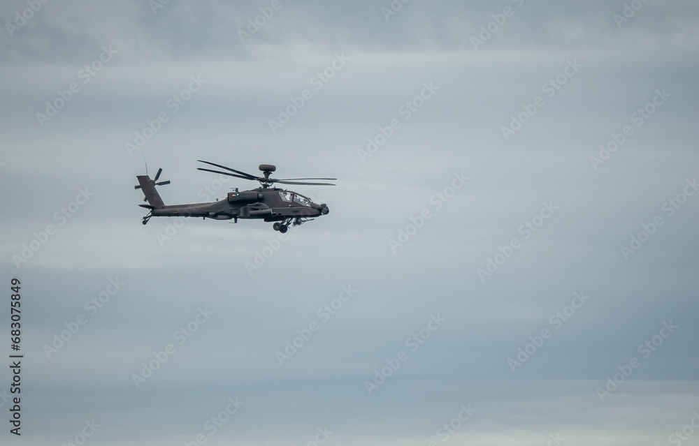 British army Boeing Apache Attack helicopter gunship AH64E (AH-64E ArmyAir606) in flight British army Boeing Apache Attack helicopter gunship AH64E (AH-64E ArmyAir606) in flight