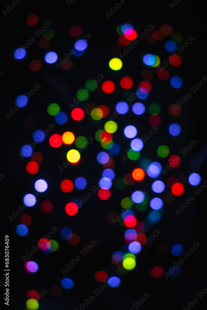 Blue, cyan, red, yellow, green blurred bokeh lights on a black background. Abstract blurred colorful bokeh light Blue, cyan, red, yellow, green blurred bokeh lights on a black background. Abstract blurred colorful bokeh light