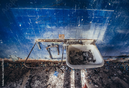 Sink in mess hall in abandoned military base Chernobyl-2 in Chernobyl Exclusion Zone, Ukraine photo