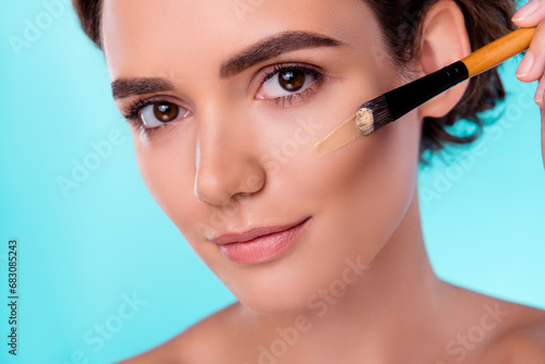 Photo of stunning perfect lady have morning routine prepare for event apply tone foundation on face with brush