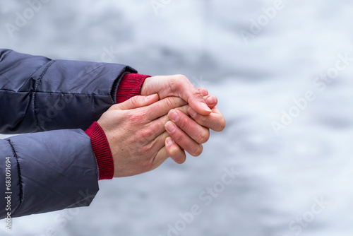 Female hands without gloves in winter.Risk of frostbite of hand outdoors during cold weather because of frost in winter.