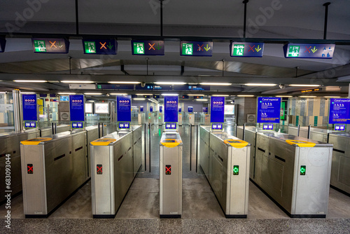 access gates through transport tickets, tickets and passes. Underground platform inside the station belonging to the Lisbon metro photo
