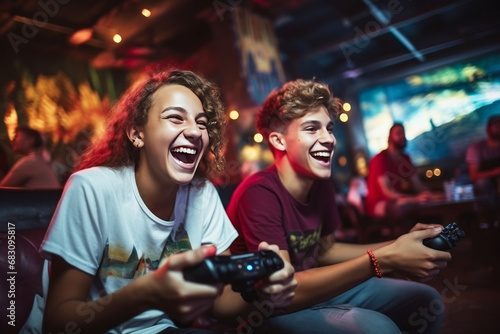Close-up of two Caucasian teenage boys playing video games. Excited young gamers with joysticks in their hands are passionate about game and having real fun. Entertainment and gaming for kids concept. photo