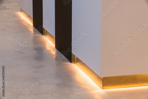 Illuminated baseboard in modern house