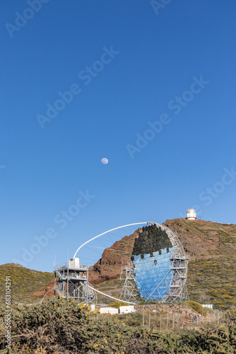 Roque de los Muchachos Observatory in Palm Island under Daylight Moon and surrounded by green area photo