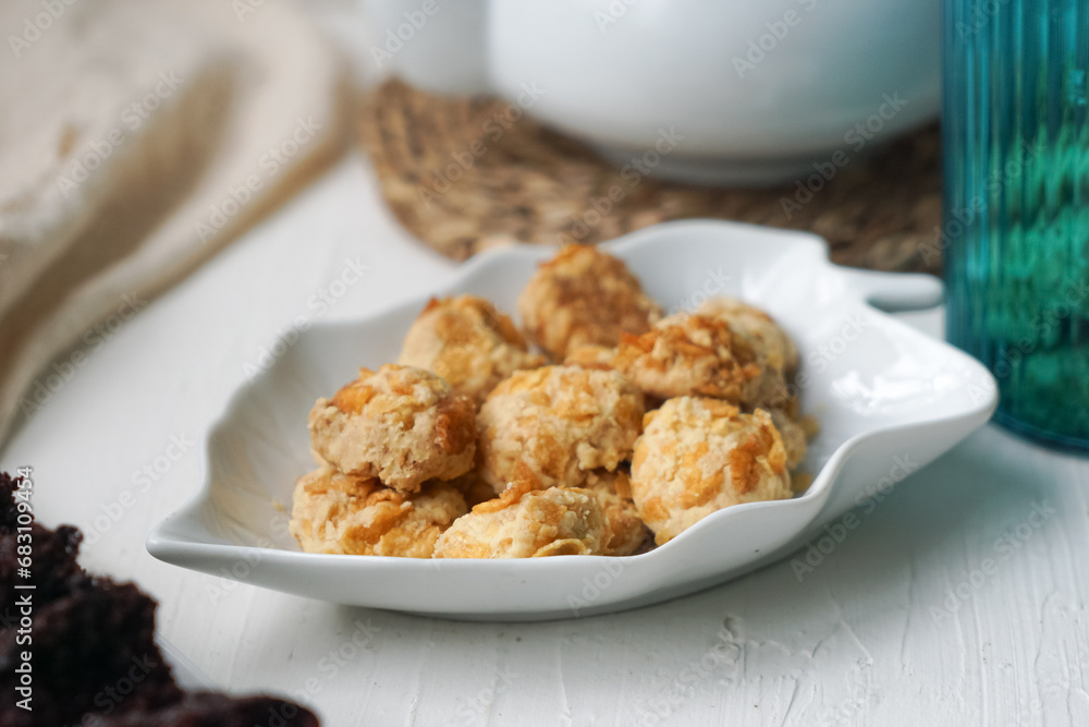 Chocolate moist cake with nuts and cornflakes cookies.