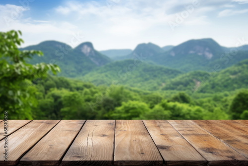 Wooden table on the mountain with green nature background