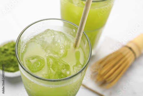Glass of delicious iced green matcha tea, closeup
