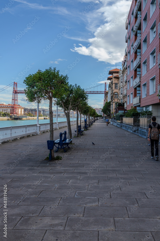 A street in Getxo, Spain with Vizcaya bridge in the background
