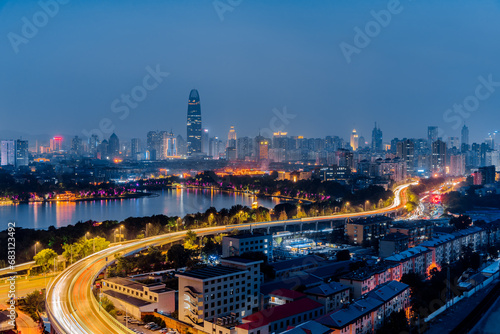 Night view of Daming Lake and city viaduct skyline in Jinan, Shandong, China