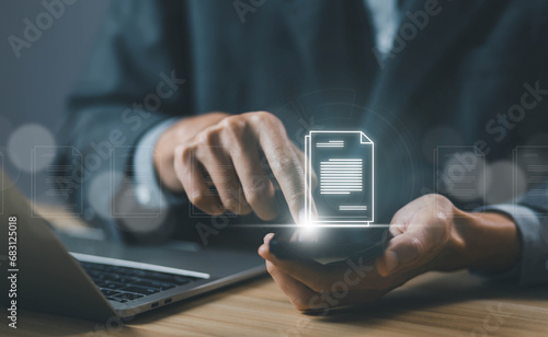businessman manages data on a laptop and phone, business paperless document files digital electronic. concept Enterprise Resource Planning system is software for management recorded in a Database.