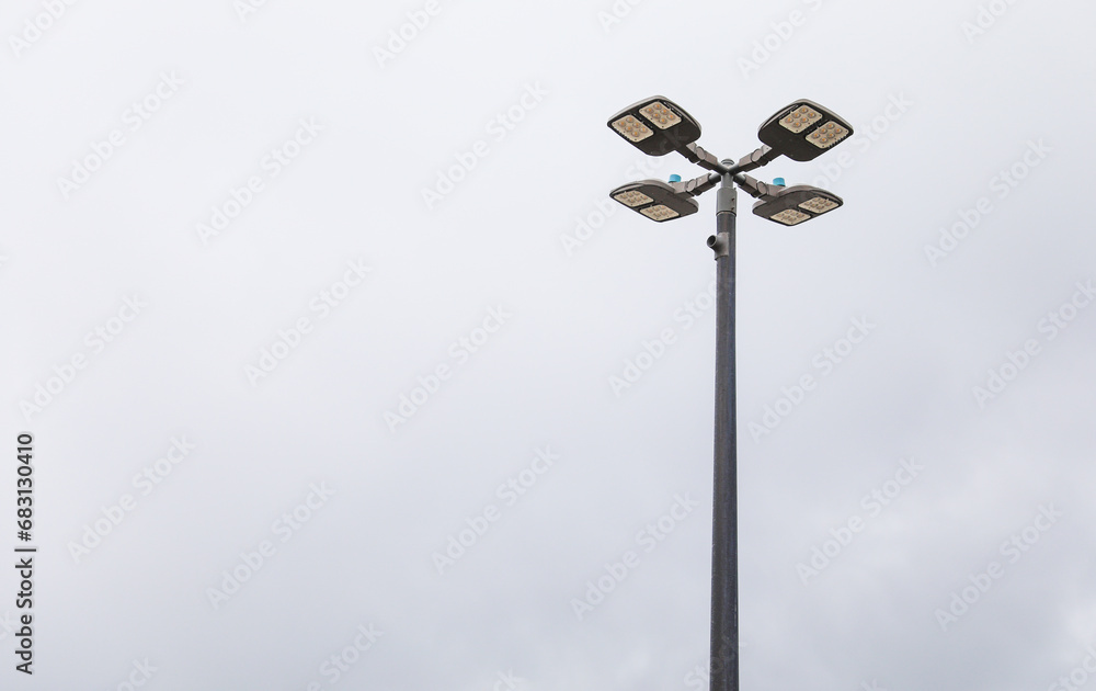 Glowing street lamp illuminates a serene urban night scene with soft light and inviting ambiance Glowing street lamp illuminates a serene urban night scene with soft light and inviting ambiance