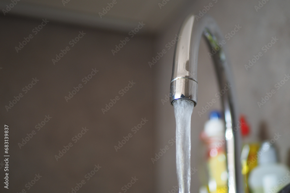 water pouring from a faucet tap slow motion water pouring from a faucet tap slow motion