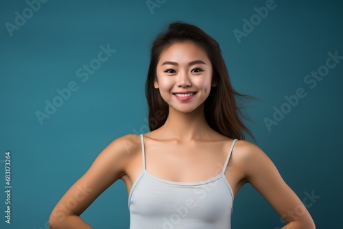 Happy young woman with a bright smile posing confidently in a white tank top for a photo shoot. Generative AI