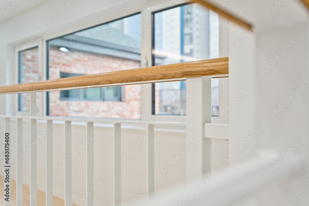 Fototapeta premium If you paint the iron frame of the railing in white, it will create a neater interior without any unnecessary elements