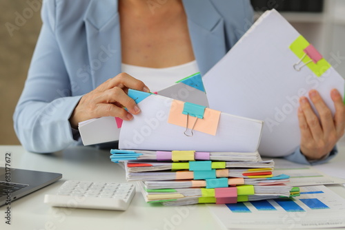 Canvastavla Senior businesswoman is stressed from doing too much paperwork.