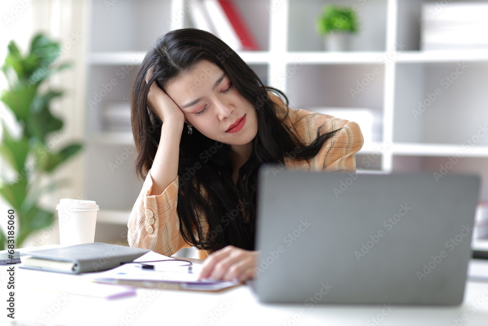 Stressed and sick businesswoman working in the office. Stressed and sick businesswoman working in the office.