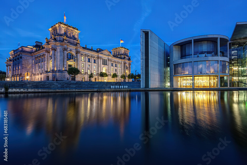 The Reichstag and the Paul-Loebe-Haus at the river Spree in Berlin during blue hour