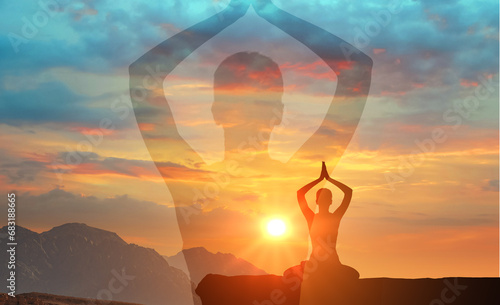 silhouette man practices yoga and meditates on mountain. serenity and yoga practicing at sunset, meditation. spiritual and mental health and peace of mind. Yoga meditation exercises