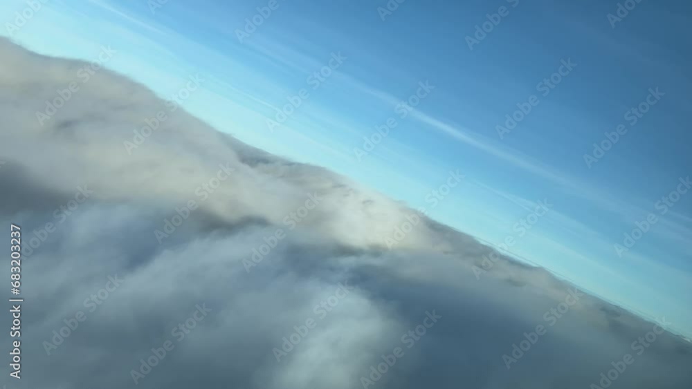 Flying over and penetrating into the fog during a left turn with the silhouette of the airplane. Daylight. 2000m high. Real time flight, as seen by the pilots. Flying over and penetrating into the fog during a left turn with the silhouette of the airplane. Daylight. 2000m high. Real time flight, as seen by the pilots.