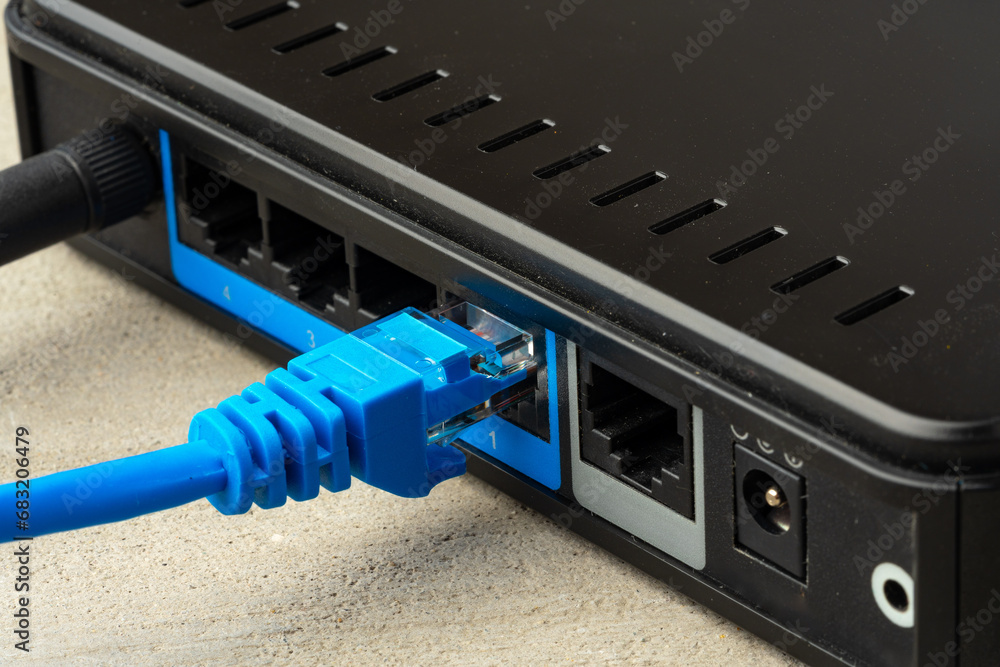 Modern router with cables plugged in close up Modern router with cables plugged in close up