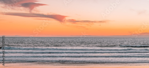 Sunset on the ocean beach in San Francisco: beautiful landscape, concept of vacation, travel, relaxation photo