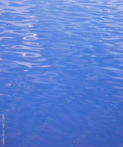 Reflection​ on surface​ blue​ water​ for​ background. Abstract​ of​ surface​ pink​ water​ for​ background.