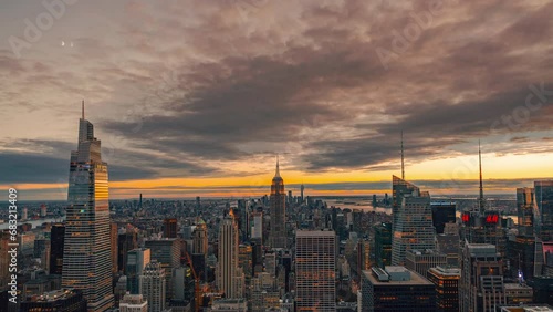 New York City Manhattan sunset. Empire State Building, skyscrapers. Epic Time lapse cinemagraph seamless video loop of the setting sun from Rockefeller Top Of The Rock.