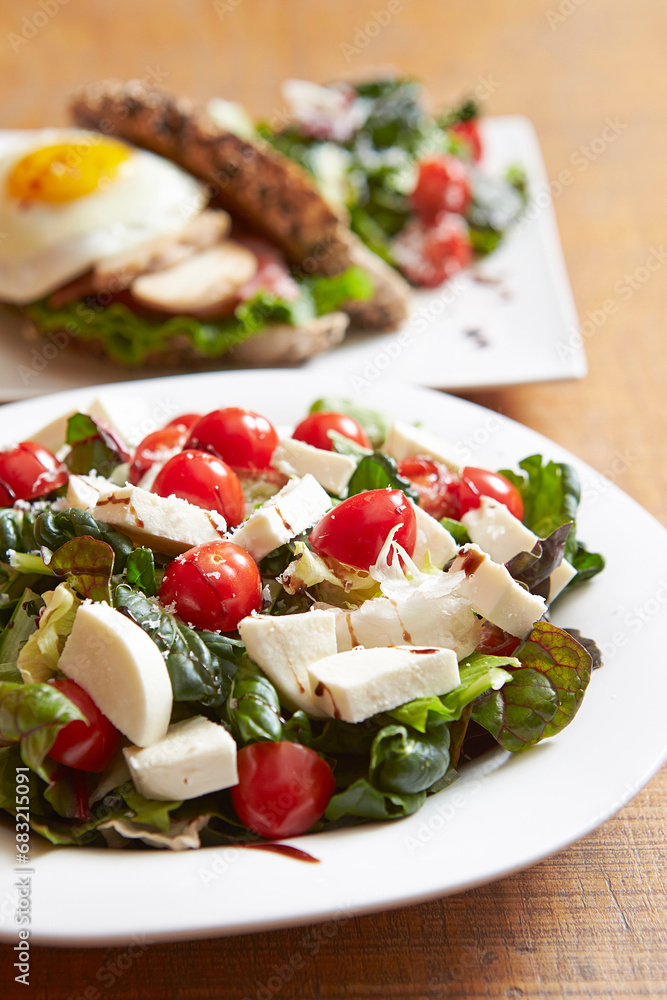 Salad with cheese and cherry tomatoes Salad with cheese and cherry tomatoes